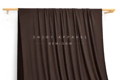 DM09-031 — Modal Spandex Rib Fabric — hanging fabric on wooden bar