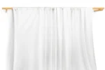 JL01-044 — Lustrous Warp Knit Nylon Spandex Fabric — hanging fabric on wooden bar