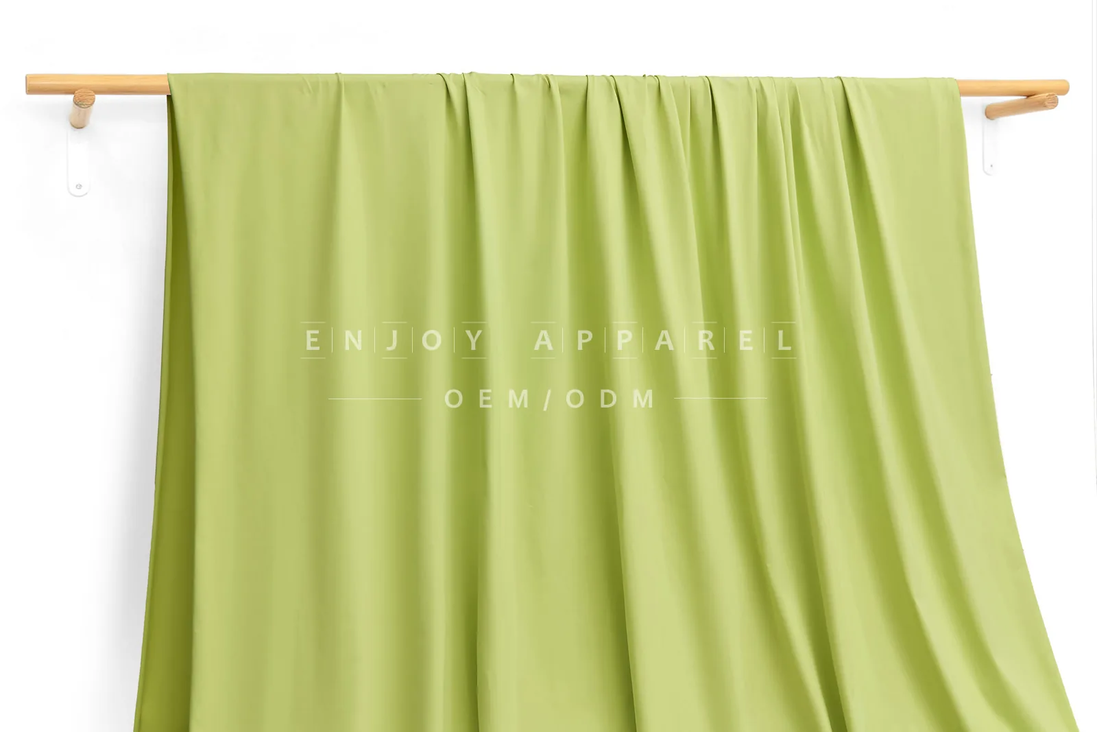 JL12-036 — Matte Single Jersey Nylon Spandex Fabric — hanging fabric on wooden bar
