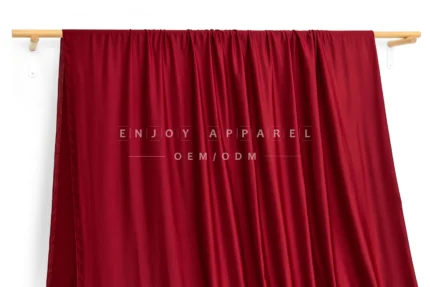 JL01-039 — 40D Lustrous Warp Knit Fabric — hanging fabric on wooden bar