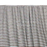 DM0007 — Cotton Spandex Waffle Fabric — hanging fabric on wooden bar