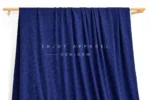 JL04-001 — Rose Jacquard Nylon Spandex Fabric — hanging fabric on wooden bar