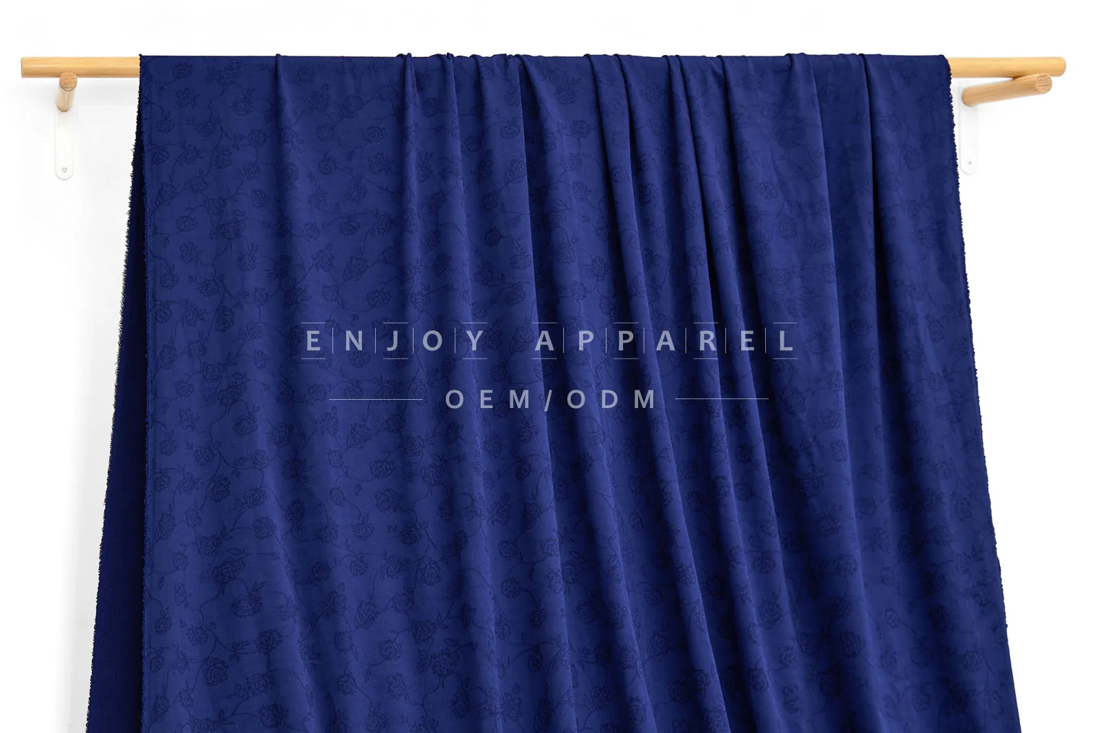 JL04-001 — Rose Jacquard Nylon Spandex Fabric — hanging fabric on wooden bar