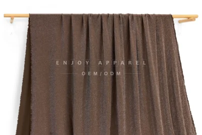 JL02-066 — Metallic Nylon Spandex Fabric — hanging fabric on wooden bar