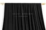 JL0079 — Nylon Spandex Swim Fabric — hanging fabric on wooden bar