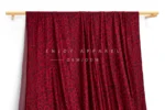 JL01-039-LEO — Leopard Print Warp Knit Fabric — hanging fabric on wooden bar