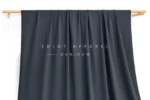 JL0085 — 36-Gauge Matte Warp Knit Nylon Fabric — hanging fabric on wooden bar