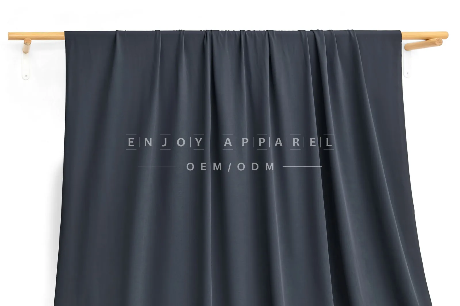 JL0085 — 36-Gauge Matte Warp Knit Nylon Fabric — hanging fabric on wooden bar