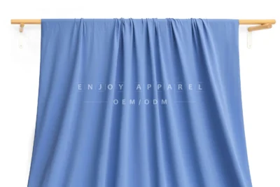 JL02-239 — Matte Warp Knit Nylon Spandex Fabric — hanging fabric on wooden bar