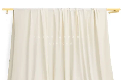 JL0087 — Matte Weft Knit Nylon Spandex Fabric — hanging fabric on wooden bar