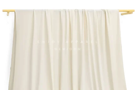 JL0087 — Matte Weft Knit Nylon Spandex Fabric — hanging fabric on wooden bar
