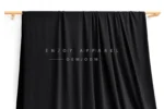 DN0007 — Warp Knit Nylon Spandex Fabric — hanging fabric on wooden bar
