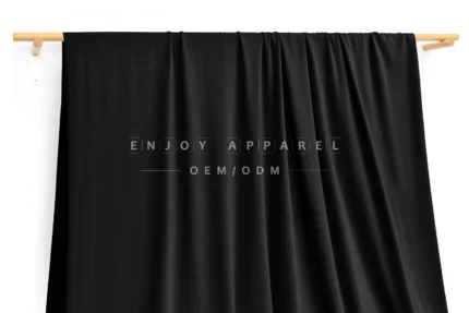 DN0007 — Warp Knit Nylon Spandex Fabric — hanging fabric on wooden bar