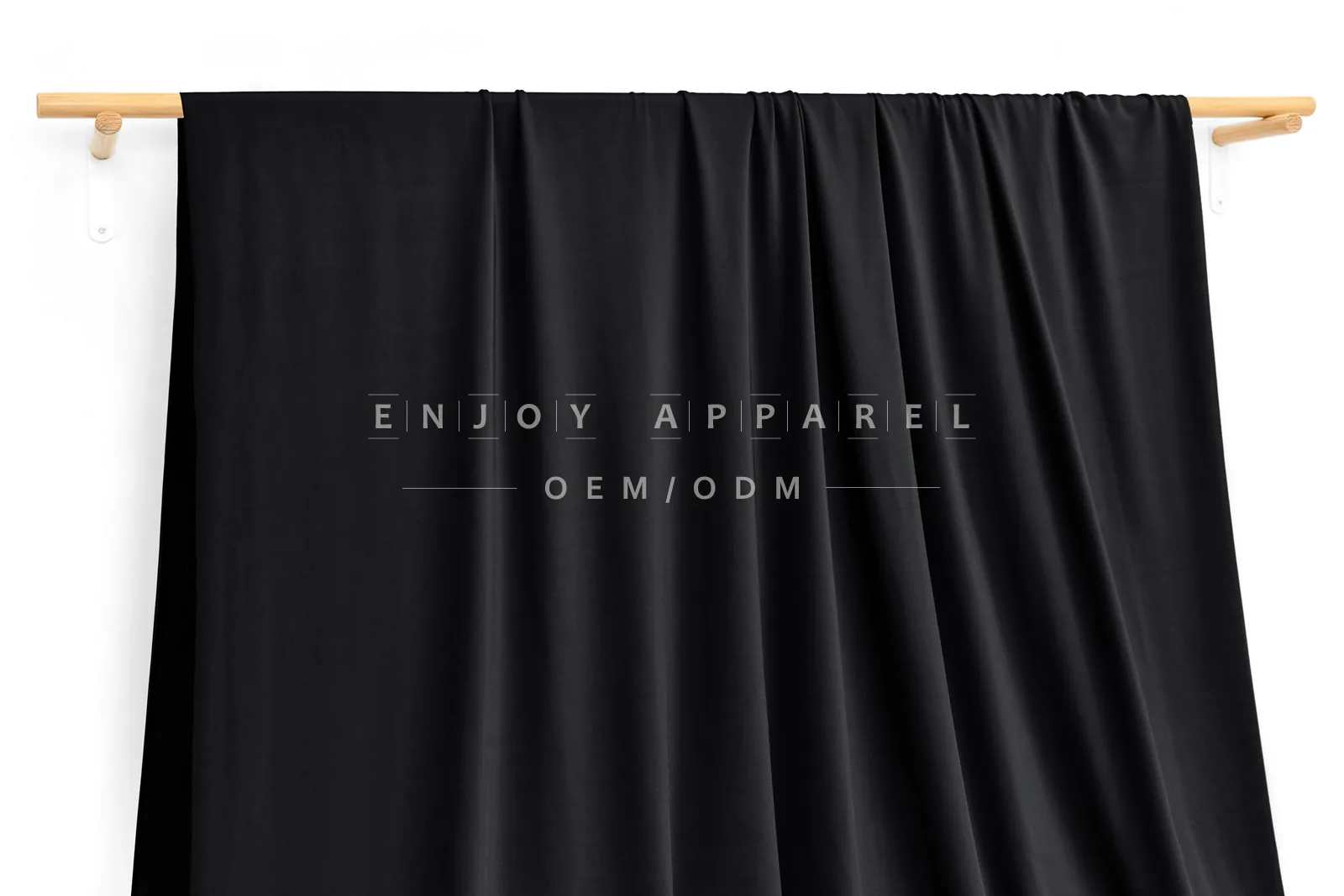 DN0007 — Warp Knit Nylon Spandex Fabric — hanging fabric on wooden bar