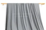 ZD03-014 — 105D Double-Brushed Recycled Polyester Fabric — hanging fabric on wooden bar