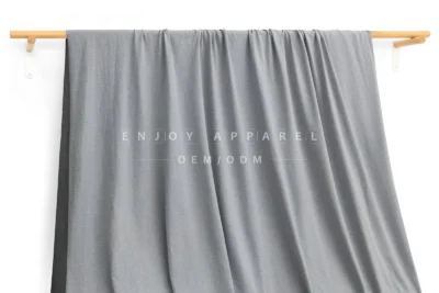 ZD03-014 — 105D Double-Brushed Recycled Polyester Fabric — hanging fabric on wooden bar