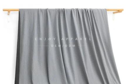 ZD03-014 — 105D Double-Brushed Recycled Polyester Fabric — hanging fabric on wooden bar