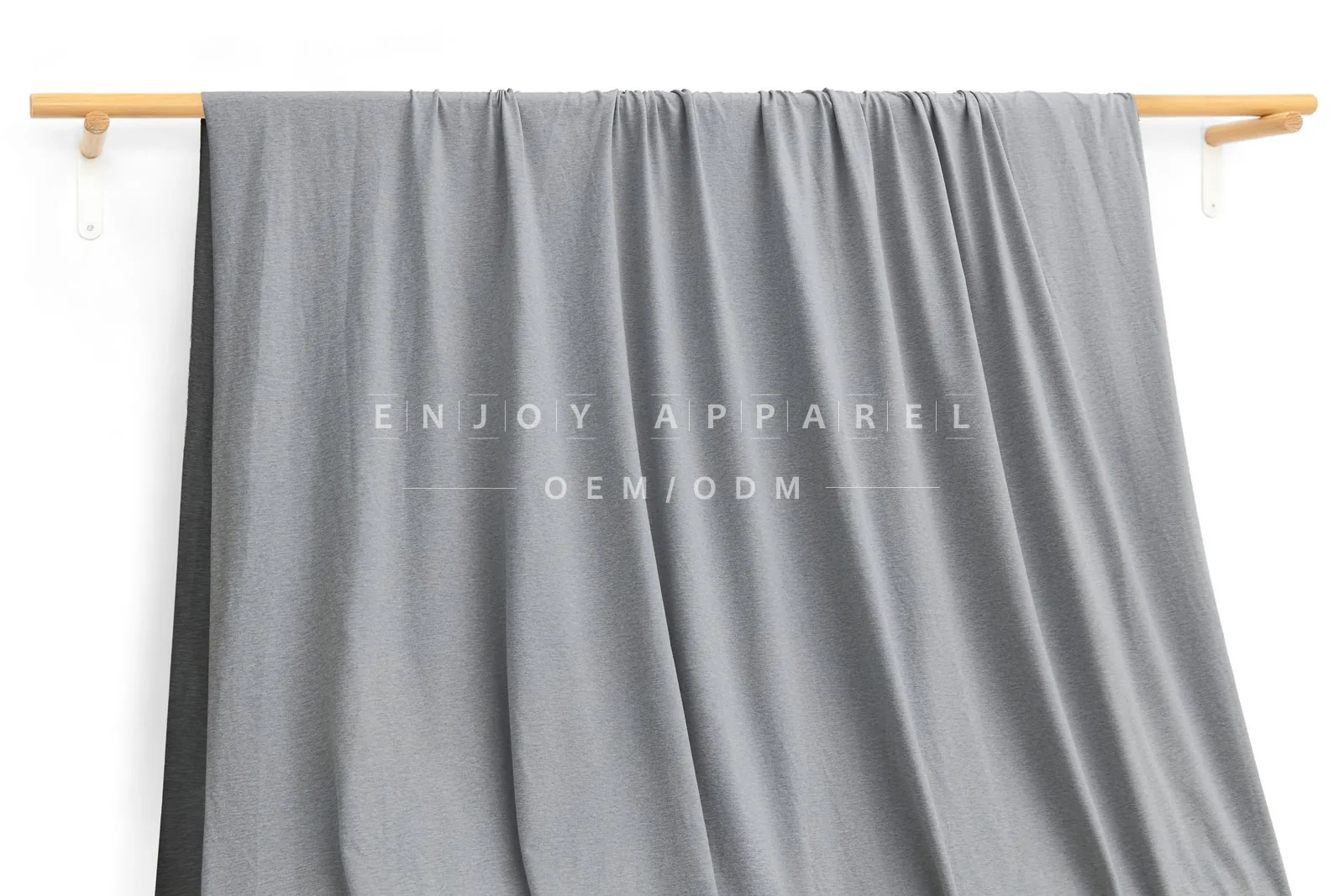 ZD03-014 — 105D Double-Brushed Recycled Polyester Fabric — hanging fabric on wooden bar