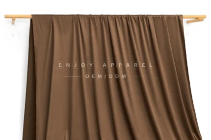 DL0053 — Weft Knit Faux Suede Fabric — hanging fabric on wooden bar